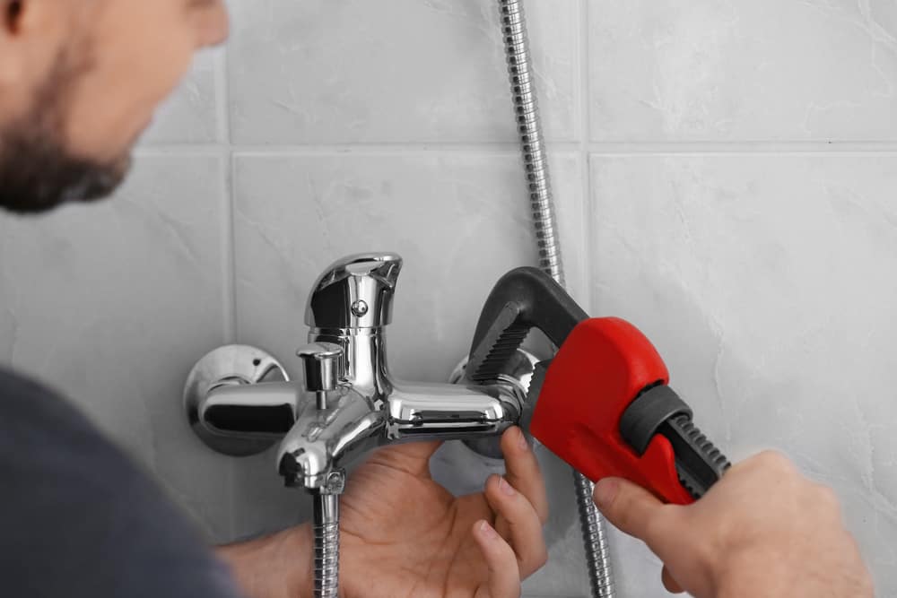 Plumber fixing Shower